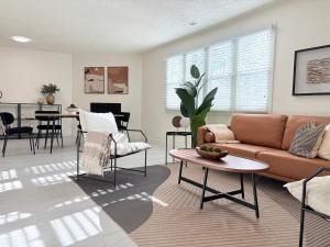 a living room with a couch and a table at SLC Condo - Walk to Everything in Salt Lake City