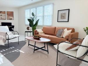 a living room with a couch and a table at SLC Condo - Walk to Everything in Salt Lake City
