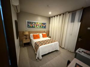 Voodi või voodid majutusasutuse Hotel Ucla Center toas