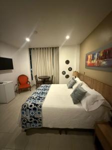 Voodi või voodid majutusasutuse Hotel Ucla Center toas