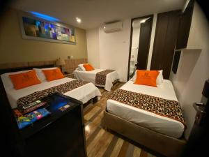 Voodi või voodid majutusasutuse Hotel Ucla Center toas