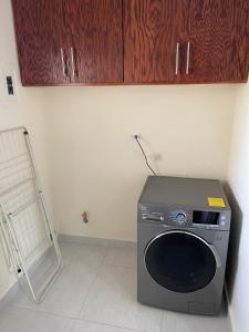 a washer and dryer sitting in a room at Hermosa casa entera cerca de la Presa del Rejón in Chihuahua