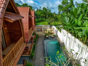 Bazén v ubytování Uma Nandhi Villa Ubud nebo v jeho okolí