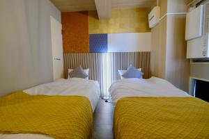 A bed or beds in a room at 桜modern 本町駅2分心斎橋10分 5名宿泊可能
