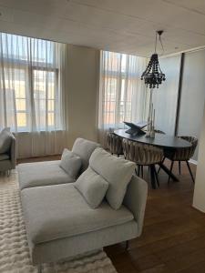 a living room with a couch and a table at Saya Loft in Amersfoort
