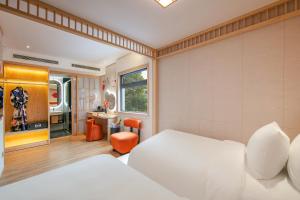 Ένα ή περισσότερα κρεβάτια σε δωμάτιο στο Aurora Oriental Hotel