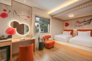 Ένα ή περισσότερα κρεβάτια σε δωμάτιο στο Aurora Oriental Hotel