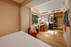 Ένα ή περισσότερα κρεβάτια σε δωμάτιο στο Aurora Oriental Hotel