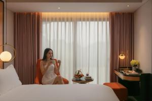 Ένα ή περισσότερα κρεβάτια σε δωμάτιο στο Aurora Oriental Hotel