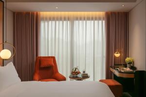 Ένα ή περισσότερα κρεβάτια σε δωμάτιο στο Aurora Oriental Hotel