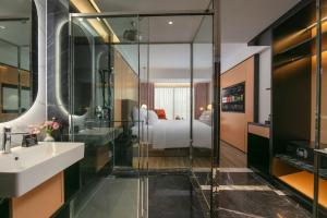 Ένα ή περισσότερα κρεβάτια σε δωμάτιο στο Aurora Oriental Hotel