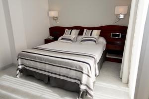Postel nebo postele na pokoji v ubytování Hotel Plaça