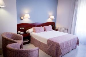 Postel nebo postele na pokoji v ubytování Hotel Plaça