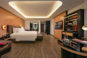 Ένα ή περισσότερα κρεβάτια σε δωμάτιο στο Aurora Oriental Hotel