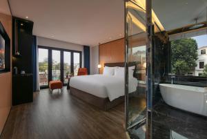 Ένα ή περισσότερα κρεβάτια σε δωμάτιο στο Aurora Oriental Hotel