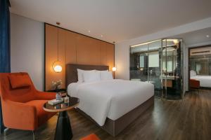 Ένα ή περισσότερα κρεβάτια σε δωμάτιο στο Aurora Oriental Hotel