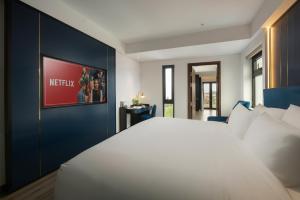 Ένα ή περισσότερα κρεβάτια σε δωμάτιο στο Aurora Oriental Hotel