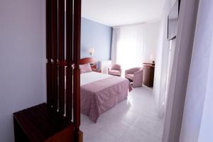 Postel nebo postele na pokoji v ubytování Hotel Plaça