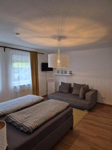 Postel nebo postele na pokoji v ubytování Ferienwohnung Knoerck Weikersheim