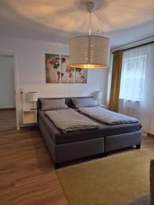 Postel nebo postele na pokoji v ubytování Ferienwohnung Knoerck Weikersheim