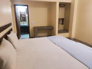 Katil atau katil-katil dalam bilik di Inn On The Bay Home