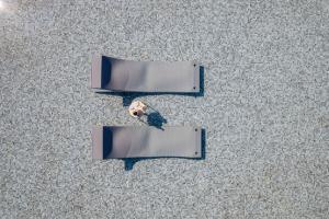 two open books on the floor with a stuffed animal at Oikos Sani Suites in Sani Beach