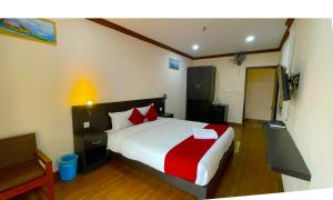 Ένα ή περισσότερα κρεβάτια σε δωμάτιο στο Hotel Juju