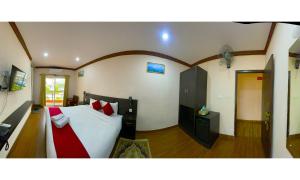 Ένα ή περισσότερα κρεβάτια σε δωμάτιο στο Hotel Juju