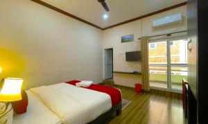 Ένα ή περισσότερα κρεβάτια σε δωμάτιο στο Hotel Juju