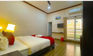 Ένα ή περισσότερα κρεβάτια σε δωμάτιο στο Hotel Juju