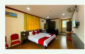 Ένα ή περισσότερα κρεβάτια σε δωμάτιο στο Hotel Juju