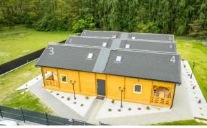 a model of a house with a gray roof at Starkowo pod lasem in Starkowo