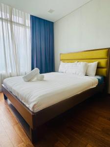 Voodi või voodid majutusasutuse Vortex Serviced Apartment KLCC By Elite Suites toas