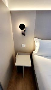 En eller flere senger på et rom på Hotel Aurora Duino
