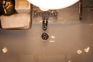 a stream of water coming out of a bathroom sink at CASA RURAL ARONA Eco Hotel Vegetariano Vegano in Arona