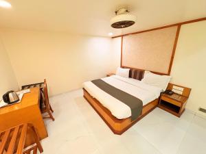 Postel nebo postele na pokoji v ubytování Hotel Vice President
