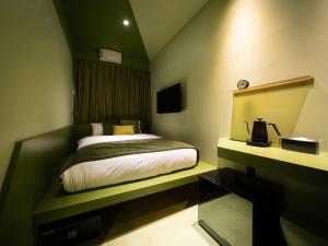 OCICA OSHIAGE TOKYO by R HOTELにあるベッド