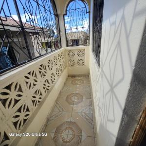 a staircase in a building with stained glass windows at Wema centre apartment in Gatunga