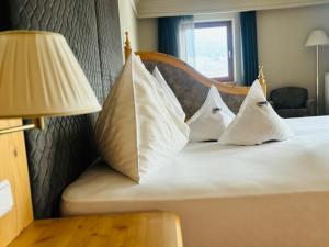 Postel nebo postele na pokoji v ubytování Naturhotel Sonnenhof