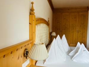 Postel nebo postele na pokoji v ubytování Naturhotel Sonnenhof