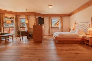 Postel nebo postele na pokoji v ubytování Naturhotel Sonnenhof
