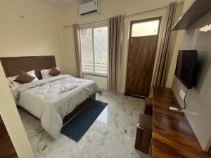DevaprayāgCinnamon Tree Hotel的相册照片 更多14张照片