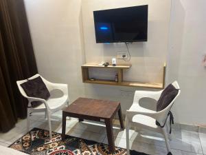 TV a/nebo společenská místnost v ubytování Hotel Amaresh