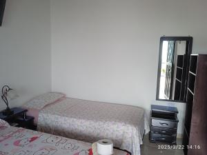 Postel nebo postele na pokoji v ubytování Hospedaje Lulú - Licores 24
