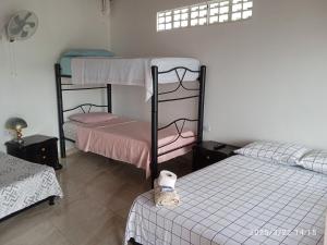 Postel nebo postele na pokoji v ubytování Hospedaje Lulú - Licores 24