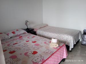 Postel nebo postele na pokoji v ubytování Hospedaje Lulú - Licores 24
