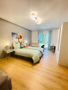 a bedroom with two beds in a room at The Villa Toscana, a serene retreat in Center of Friedrichshafen City with lush green lawns, terrace & private garage- Lidl, Bakery walking distance- Bodenseecenter, Sportsbad 3 mins, Lake 7 mins in Friedrichshafen