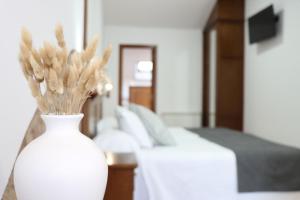Posteľ alebo postele v izbe v ubytovaní Hotel Pazos Alba
