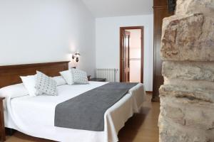 Posteľ alebo postele v izbe v ubytovaní Hotel Pazos Alba