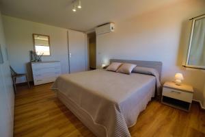 A bed or beds in a room at San Martino Holiday Apartments